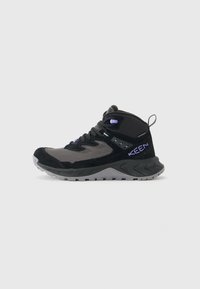 Black and gray high-top hiking shoe with purple accents, thick sole, textured grip, and pull tab at the heel.