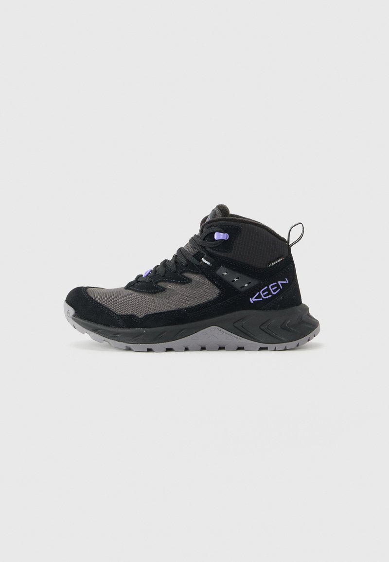 Black and gray high-top hiking shoe with purple accents, thick sole, textured grip, and pull tab at the heel.