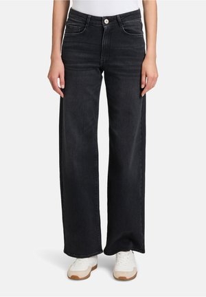 Schwarze weit geschnittene Jeans aus Denim, mit Fronttaschen, einem Reißverschluss und einem Knopfverschluss sowie weißen Nahtakzenten.