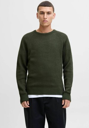 Green ribbed knit sweater with a crew neck, long sleeves, and a relaxed fit, featuring a textured surface and side label detail.