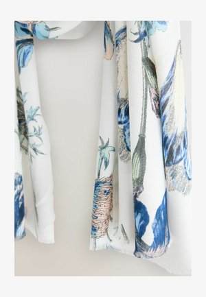 Lagani šal s cvjetnim uzorkom u bijeloj boji, s plavim i pastelno obojenim detaljima. Mekani materijal s resicama, lijepo pada.