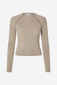 Bēšas krāsas ribots džemperis ar garām piedurknēm, pieguloša silueta un dekoratīvām griezuma detaļām plecu šuvēs.