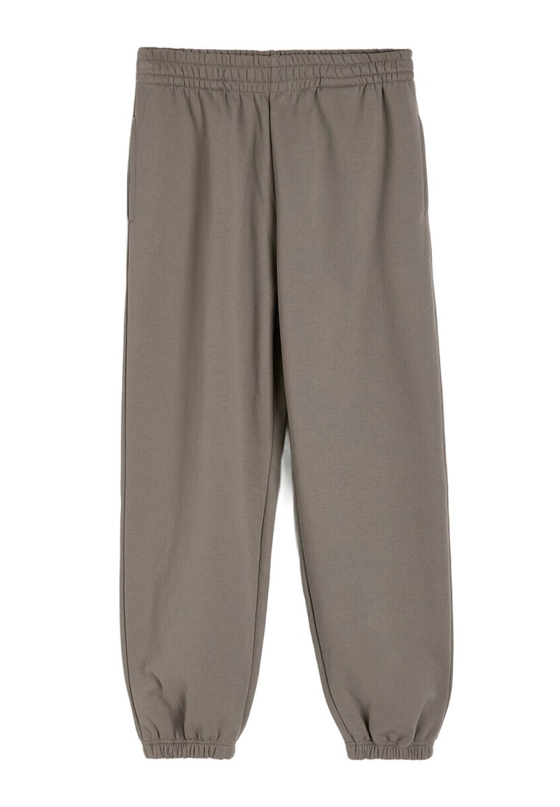 Szare dresy z miękką teksturą, elastycznym paskiem w talii i elastycznymi mankietami na kostkach. Posiada boczne kieszenie i luźny krój.