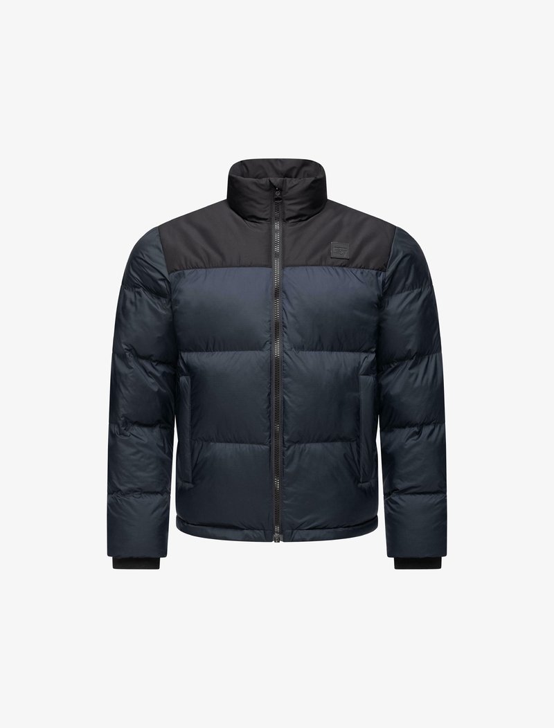 Tömpse jakk, millel on tumesinine keha ja must ülemine paneel, lukukinnitus, kõrge krae ja elastsed mansetid. Tekstureeritud, isoleeritud kangas.