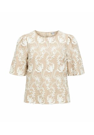 Blouse beige à manches courtes avec manches bouffantes et motif de broderie florale blanche sur tout le tissu.
