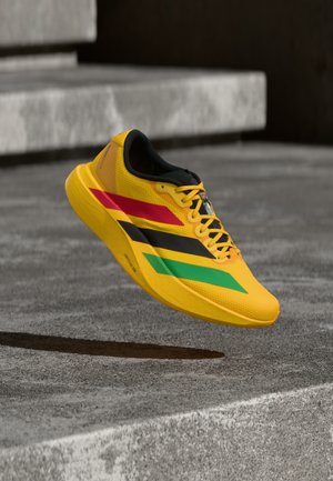 ADIZERO EVO SL - Športni copati - bold gold-coloured/vivid green/pure ruby