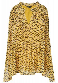 Žlutá halenka s plisovaným designem, má výstřih do V a abstraktní hnědo-bílý puntíkovaný vzor, vyrobená z lehké látky.