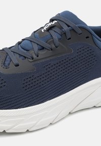 Blue athletic shoe featuring a mesh upper with perforations, reinforced overlays, and a white cushioned sole. HOKA logo visible on the tongue.