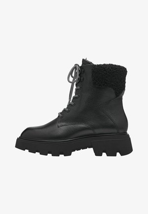 Black leather ankle boots with textured finish, chunky rubber sole, and a fuzzy black collar, featuring round laces and metal eyelets.