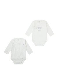 Dos bodies de manga larga para bebé en algodón blanco suave. Uno presenta lunares, el otro tiene un diseño gráfico con animales divertidos.