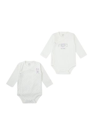 Dos bodies de manga larga para bebé en algodón blanco suave. Uno presenta lunares, el otro tiene un diseño gráfico con animales divertidos.
