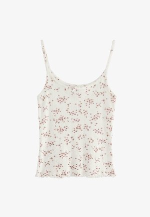 Vit blommig mönster cami med tunna axelband, med en texturerad ribbad design och en volangkant. Blommorna är i rosa och beige toner.