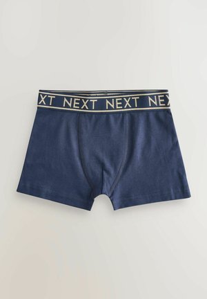 Marineblaue Baumwollboxershorts mit einem goldakzentuierten Bund, der das Wort "NEXT" zeigt. Sie verfügen über eine weiche Textur und eine enganliegende Passform.