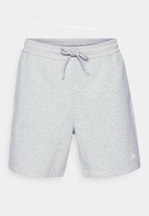 Ljusgrå shorts i mjukt material, med elastisk midja och dragsko, sidofickor och en liten logotyp vid fållen.