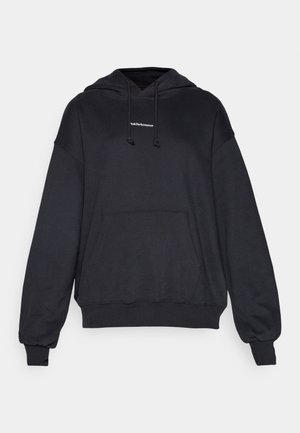 Black hoodie made of a soft material, featuring a hood with drawstrings, a front pocket, and ribbed cuffs and hem. Minimalist logo detail.