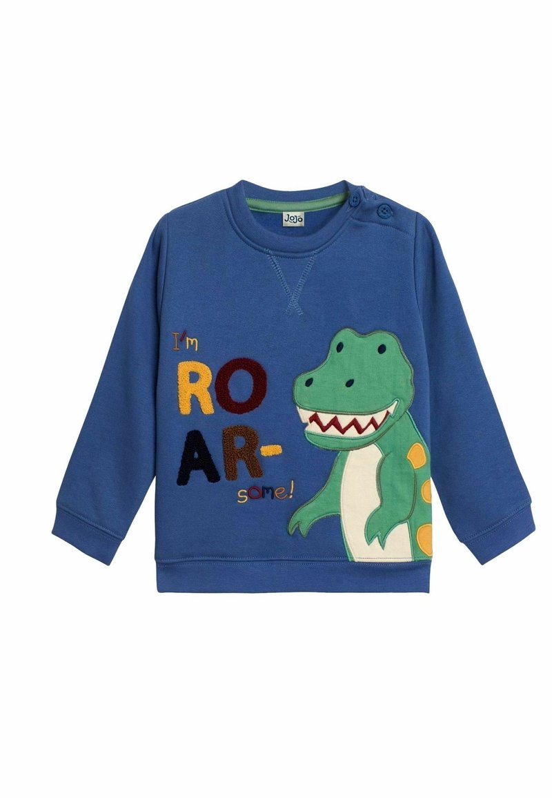 Sweat-shirt bleu avec un dessin de dinosaure vert et le texte « Je suis ROAR-some ! » en lettres colorées, avec des boutons sur l'épaule.