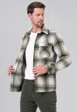 Green and white plaid jacket made of textured fabric, featuring two front pockets, button closure, and long sleeves.