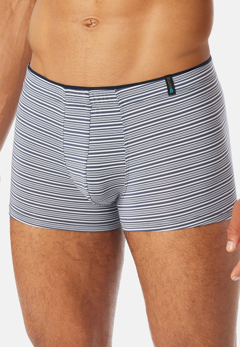 Striped boxer shorts in navy and white, made of soft fabric. Fitted design with an elastic waistband, featuring a front pouch and tag visible.