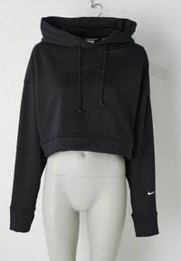 Svart kortermet hettegenser laget av myk stoff med hette, snor og brodert "NIKE PRO"-logo på forsiden, har lange ermer.