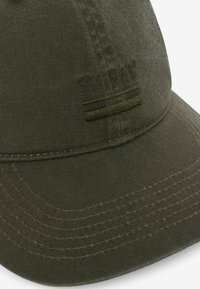 Olive green cap with a curved brim, made of textured fabric. Features embroidered "SIGNAL" logo and horizontal stripes in a matching color.