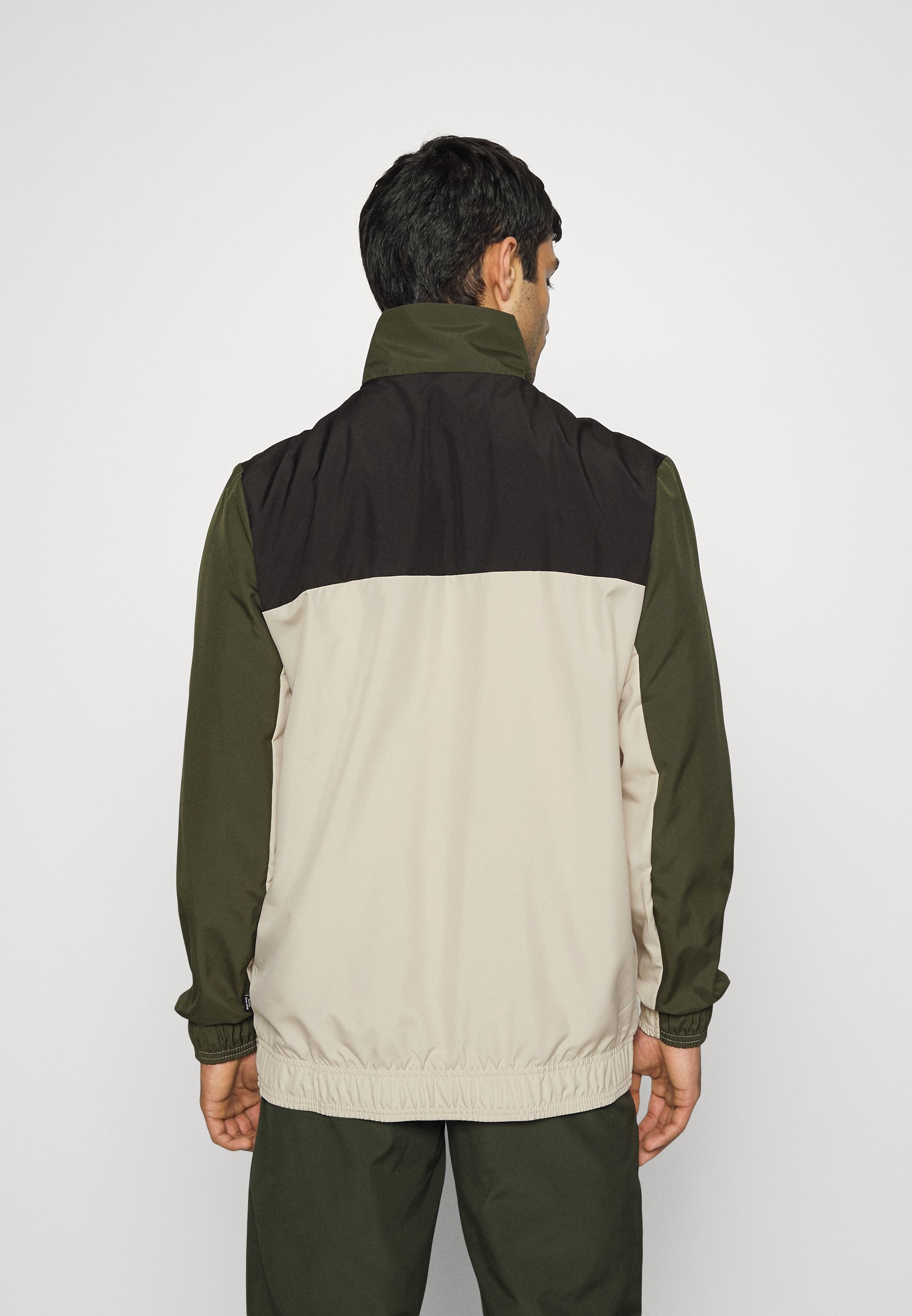Puma WOVEN SUIT - Chándal - forest night/caqui - Zalando.es