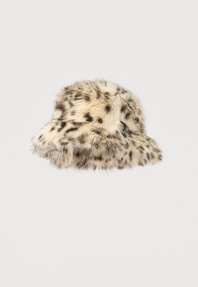 Krém színű, fekete leopárd foltokkal díszített műszőrme kalap. Puha tapintású, lekerekített tetejű; a karimája lefelé enyhén keskenyedik.
