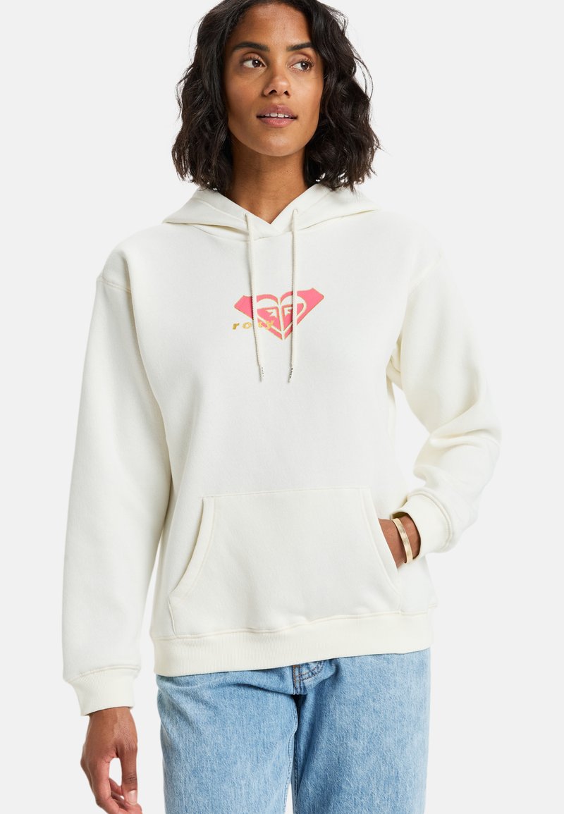 Sudadera con capucha color crema que presenta un logo de diamante rosa en el pecho, bolsillo canguro delantero y puños y dobladillo de canalé. Material suave de mezcla de algodón.
