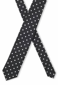 Svart slips med vit rutig mönster, texturerad tyg och diagonal prickdesign. Intressanta punkter inkluderar enhetlig mätning och geometriska accenter.