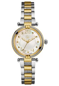 Ura z zlatim in srebrnim tonom z okroglo številčnico iz matere perle, označeno z rimskimi številkami, in strukturiranim dvotonskim kovinskim naramkom.