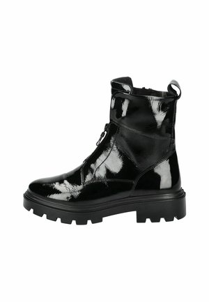 Black ankle boots made of glossy patent leather, featuring a zip closure, chunky rubber sole, and a pull tab at the back.