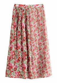 Jupe plissée florale en rouge, rose et vert. Présente une taille haute, un tissu léger et un mélange de grands et petits motifs floraux.