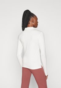 Champion ICONS LONG SLEEVE - Hosszú ujjú felső - white