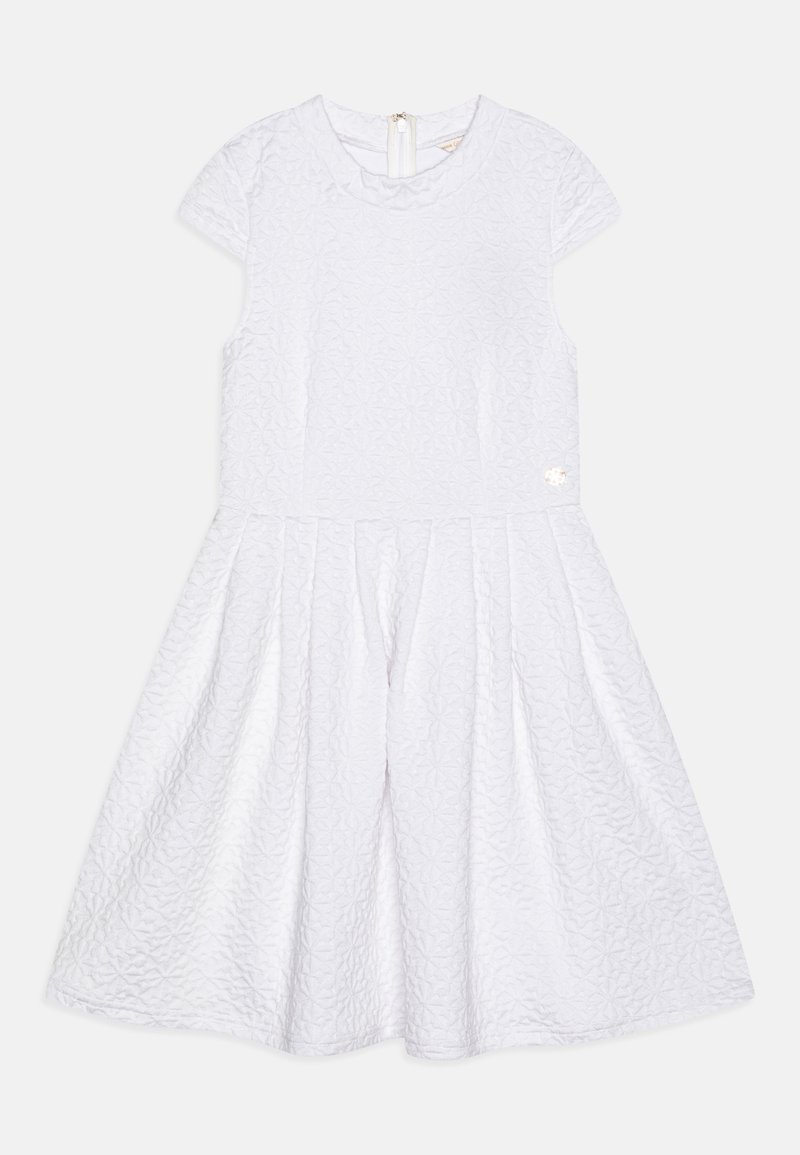 White, short-sleeve dress with a textured pattern, flared skirt, and a back zipper. A small decorative accent is present on the side.