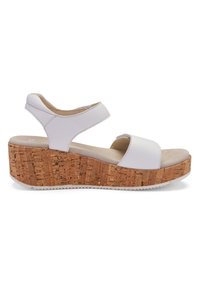 White wedge sandals featuring a cork platform, open toe, and adjustable ankle strap, with a smooth leather upper and padded footbed.