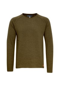 Chemise à manches longues vert olive en tissu texturé, dotée d'un col rond et de manches raglan, avec une petite étiquette brune à l'ourlet.