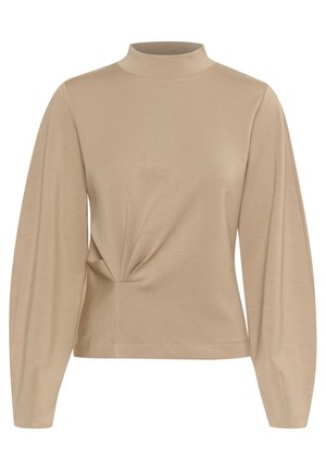 Beżowa bluzka z długim rękawem i wysokim kołnierzem, z przekręconym wzorem z przodu oraz gładką, miękką fakturą materiału z delikatnym połyskiem.