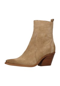 Beige suede ankle boot with a pointed toe, western stitching, and a brown wooden stacked heel. Features a pull tab for easy wear.