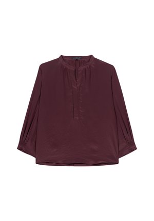 Burgundy blouse with a collarless V-neck, long sleeves with gathered cuffs, and soft, shiny texture. Features subtle pleating at neckline.