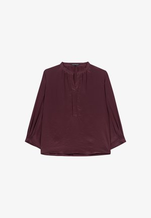 Burgundy blouse with a collarless V-neck, long sleeves with gathered cuffs, and soft, shiny texture. Features subtle pleating at neckline.