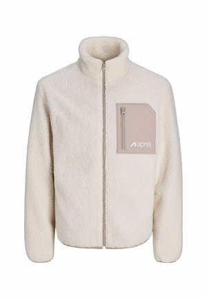 Chaqueta de forro polar de color crema con un cuello alto, cremallera completa y un bolsillo beige en el lado izquierdo del pecho que cuenta con una pequeña cremallera.