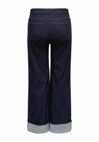 Široke kavbojke iz temno modrega jeansa z zavihanim robom. Imajo dva zadnja žepa in kontrastno rdeče šive.