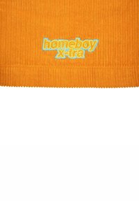Orange corduroy fabric features ribbed texture. "homeboy" embroidered in yellow, "x-tra" in light blue, at the bottom.