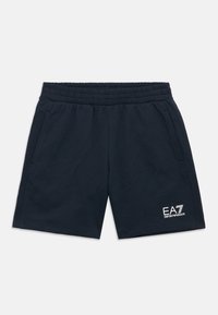 Tumesinised lühikesed püksid pehmest kangast, millel on elastne vöökoht ja küljetaskud. Vasakul jalal on valge EA7 logo.