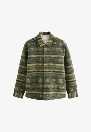 Grön mönstrad skjorta gjord av tyg med en mjuk textur, med svarta och beige geometriska mönster, knäppning framtill och en bröstficka.