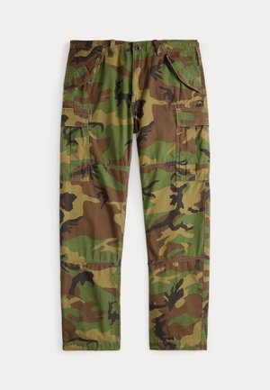 Cargo pants in a camouflage pattern with greens, browns, and black. Features multiple side pockets and a relaxed fit. Cotton material.