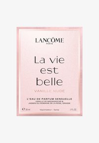 Boîte pailletée rose avec une bordure blanche ; présente un texte noir en gras indiquant "La vie est belle" et "Vanille nude" ; parfum de 30 ml.