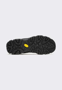 Suola di scarpa in gomma nera con scanalature profonde e aggressive per la presa; presenta un logo Vibram giallo al centro e una finitura testurizzata.