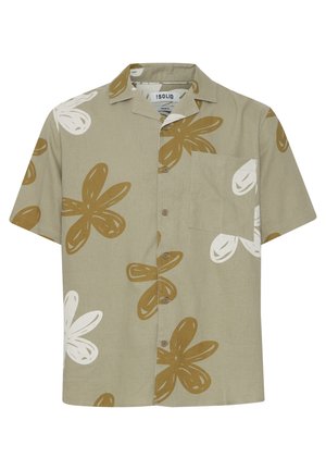 Koszula z krótkim rękawem, z kołnierzykiem w kolorze khaki, z dużymi brązowymi i białymi wzorami kwiatowymi. Posiada kieszeń na piersi i zapięcie na guziki z przodu.