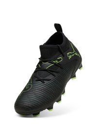 Botas de fútbol negras con acentos verdes, parte superior texturizada, puntera redondeada y ajuste tipo calcetín. Cuenta con cierre de cordones y tacos moldeados.