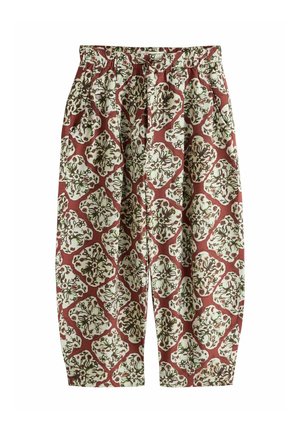 Loose-fitting pants with elastic waistband featuring a repeating floral pattern in white, brown, and green on a muted red background.